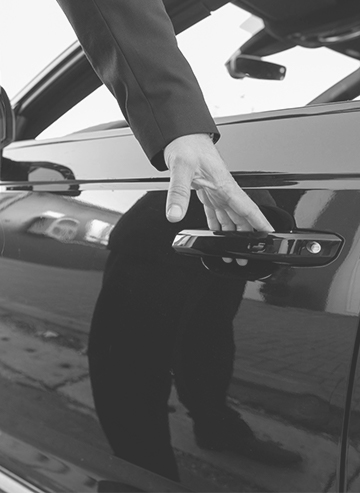 Chauffeur opening car door