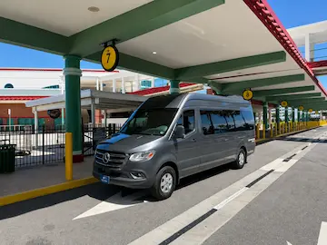 Premium Sprinter van parked near Port Canaveral. Luxurious group cruise transportation and private shuttle service by The Genie.
