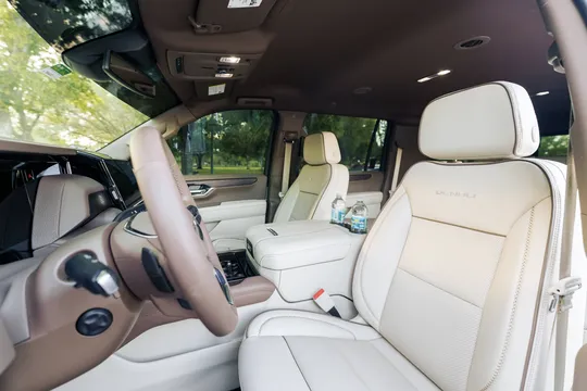 Premium car interior view from the driver's seat door, showcasing a luxury vehicle for private transfers to your International Drive hotel by The Genie.