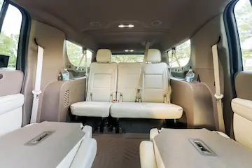 Luxurious interior of a premium private vehicle designed for stress-free vacation travel to Universal Orlando by The Genie.